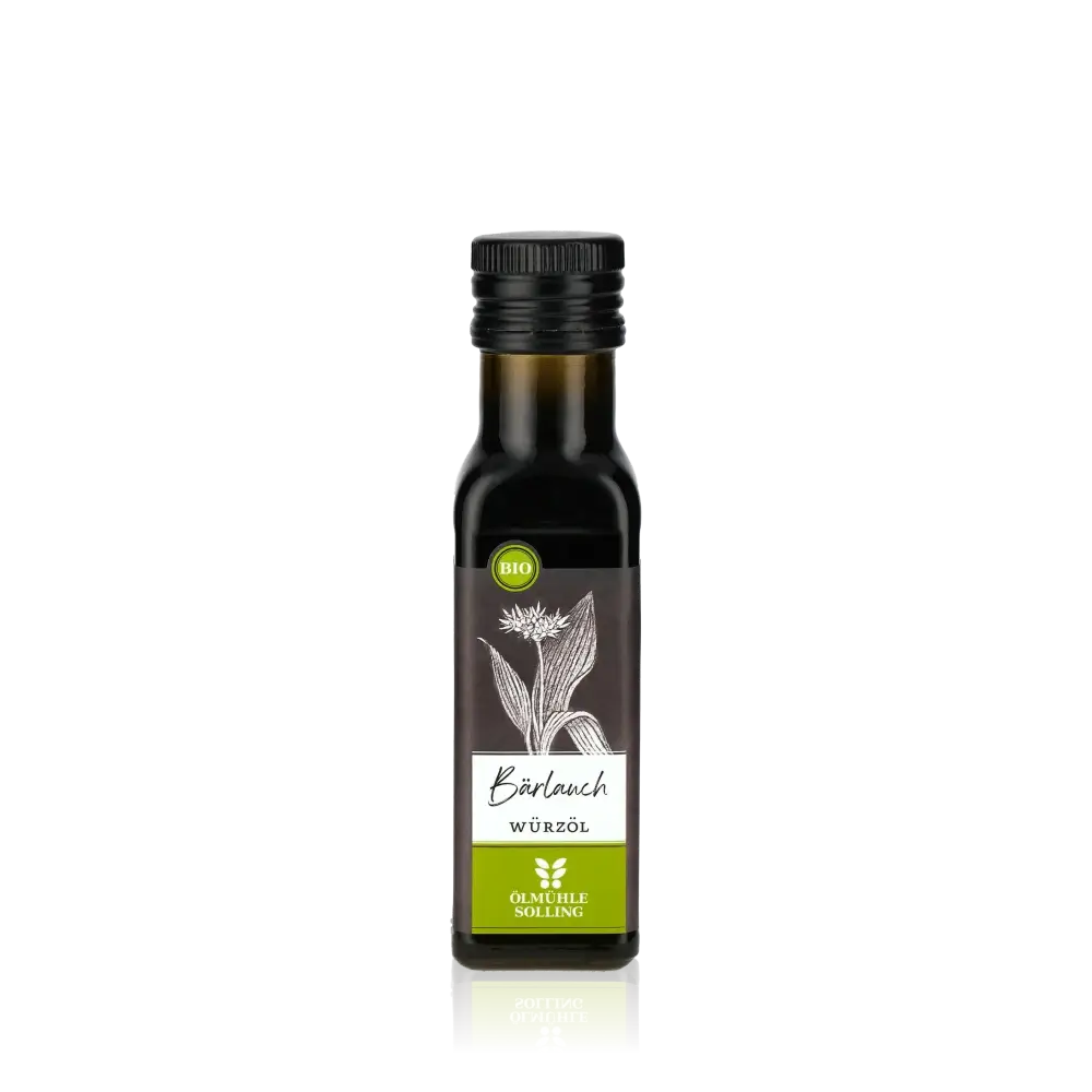Ölmühle Solling Bärlauch Würzöl Flasche vor schwarzem Hintergrund.
