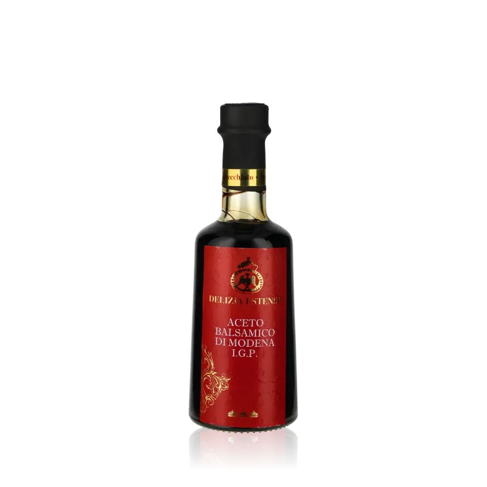Delizia Estense Balsamico Essigflasche vor schwarzem Hintergrund.