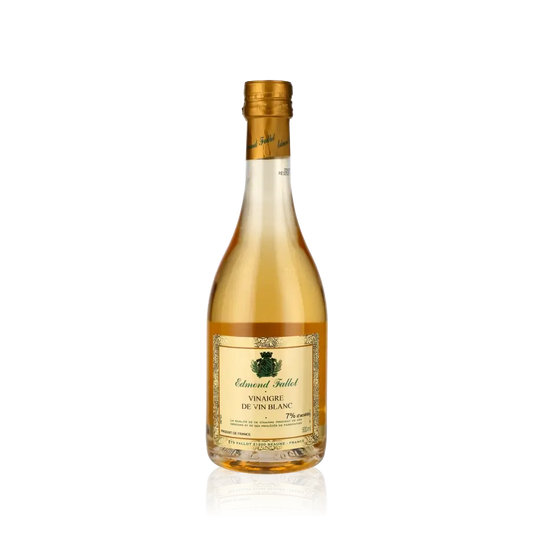 Flasche Edmond Fallot Weißweinessig vor schwarzem Hintergrund.