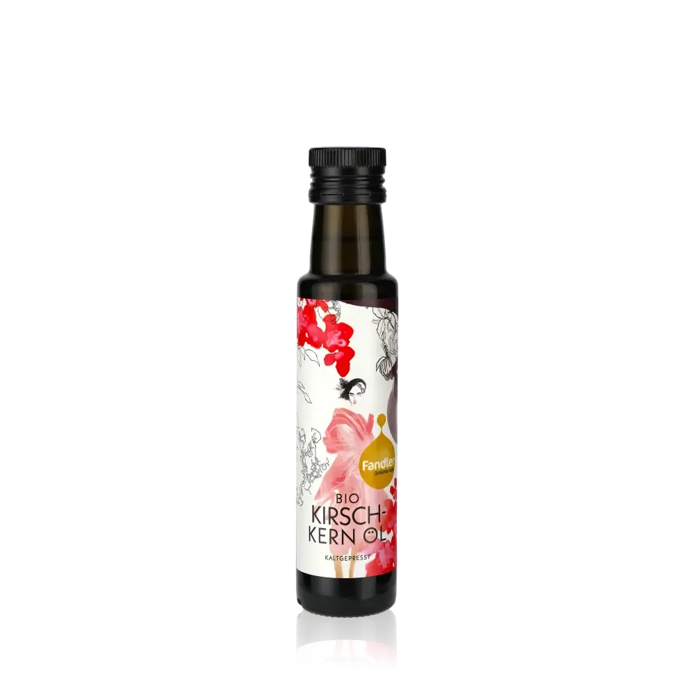 Fandler Bio Kirschkernöl Flasche auf schwarzem Hintergrund.