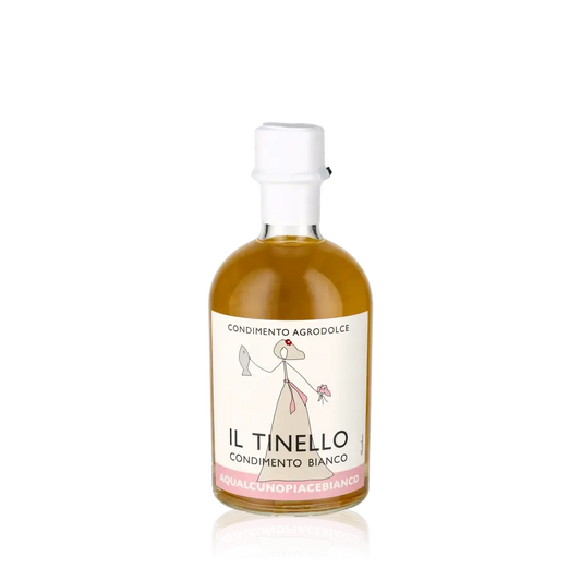 Il Tinello Condimento Bianco Flasche vor schwarzem Hintergrund.