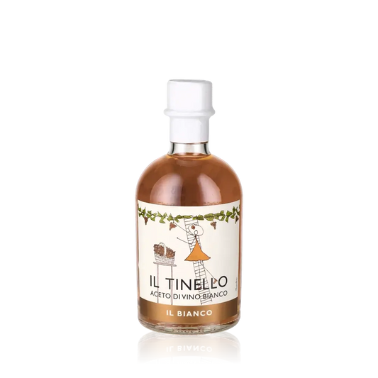 Weißweinessigflasche Il Tinello Il Bianco vor schwarzem Hintergrund.