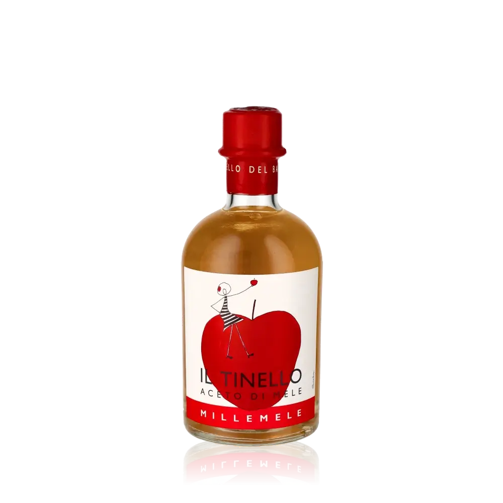 Il Tinello Millemele Apfelessig Flasche vor schwarzem Hintergrund.