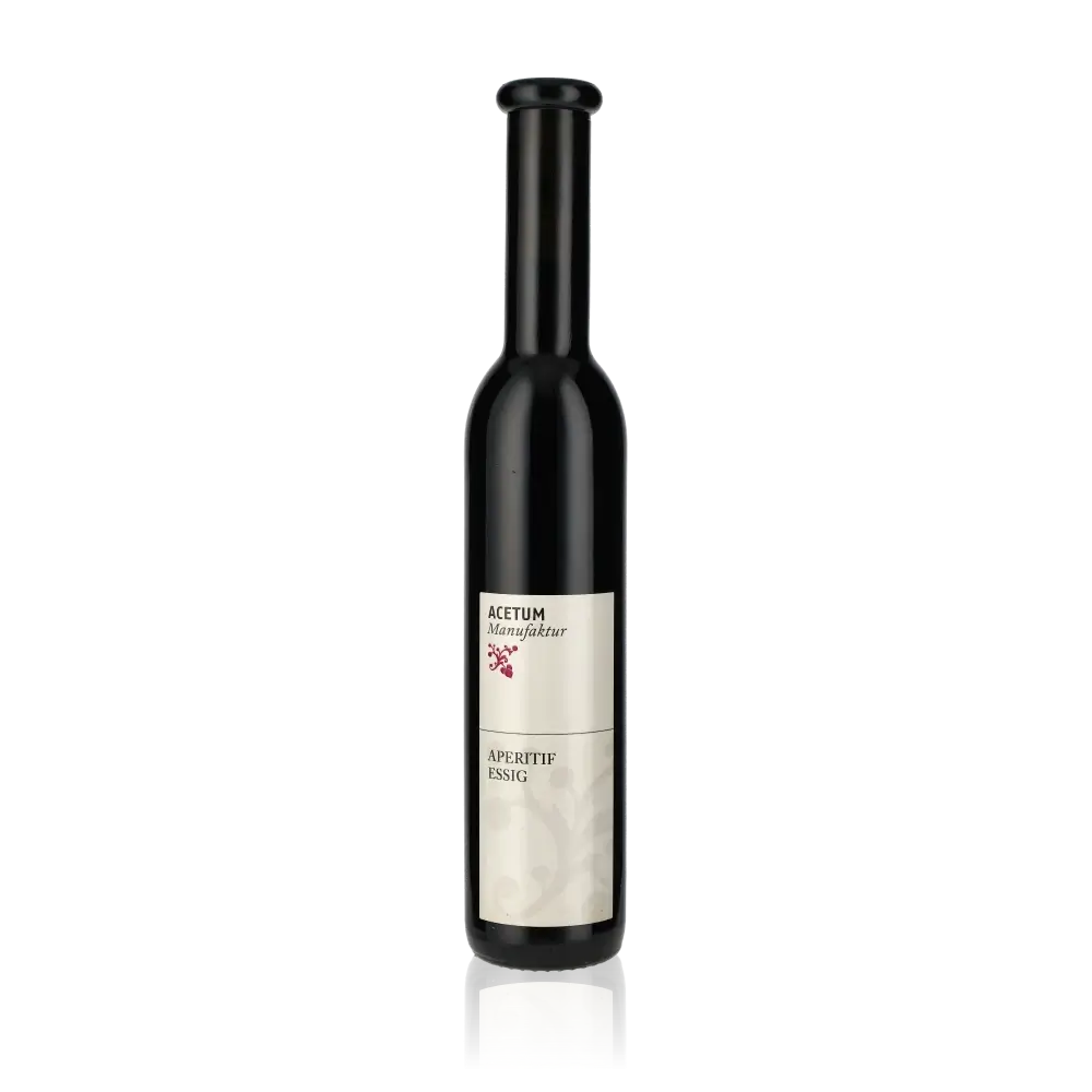 Flasche Acetum Manufaktur Aperitif-Essig vor schwarzem Hintergrund.
