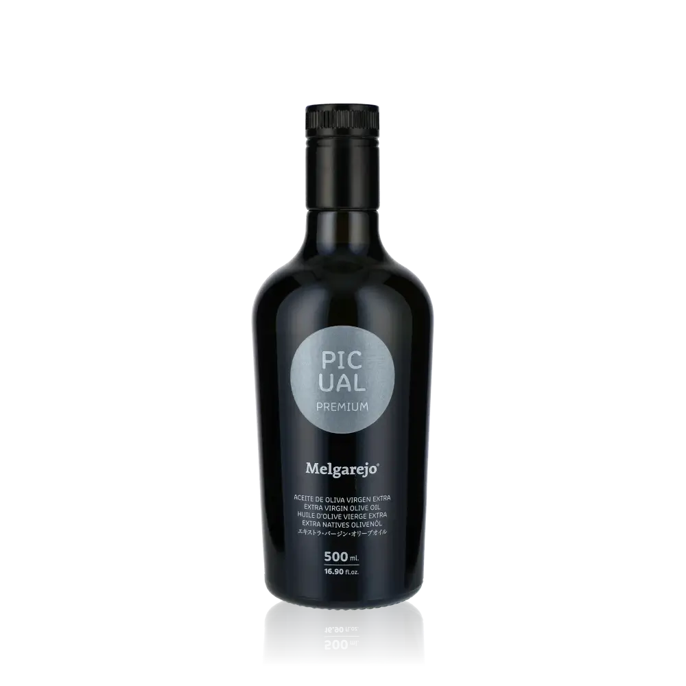 Melgarejo Picual Olivenöl Flasche vor schwarzem Hintergrund.