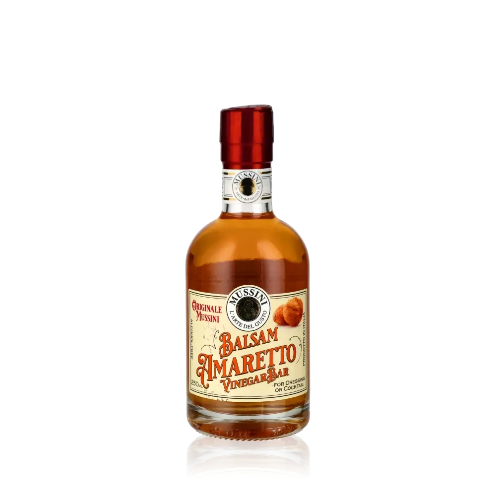 Mussini Balsam Amaretto Vinegar Flasche vor schwarzem Hintergrund.