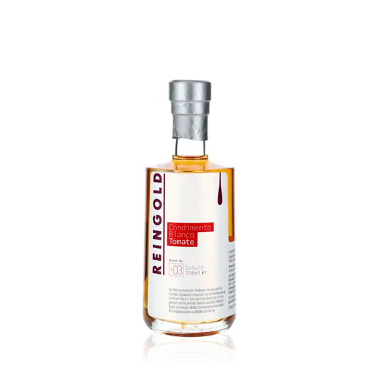 Reingold Condimento Bianco Tomate Flasche vor schwarzem Hintergrund.