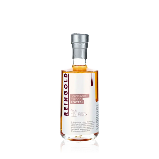 Reingold Condimento Bianco Trüffel Essigflasche auf schwarzem Hintergrund.