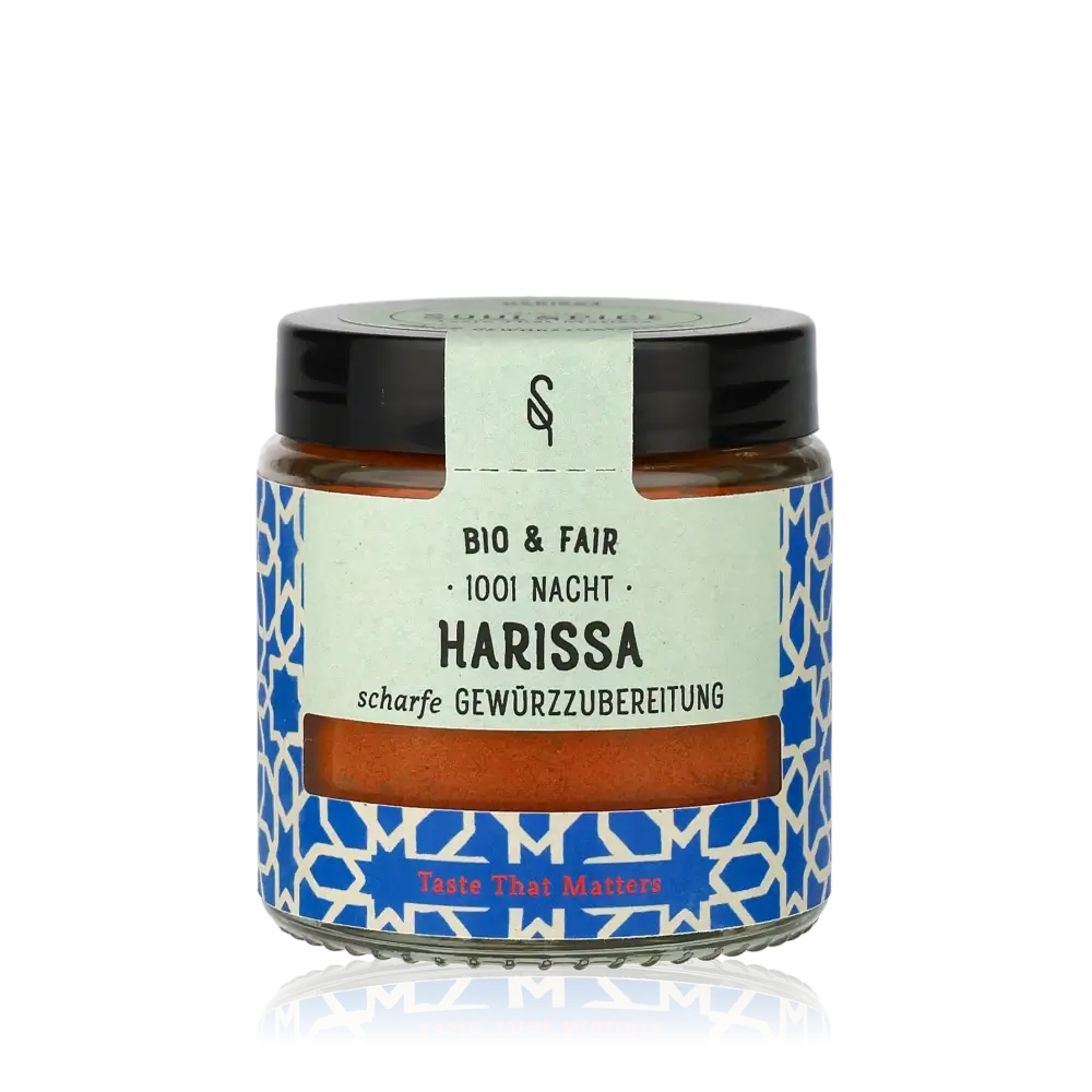 Harissa-Gewürz im Glasbehälter.