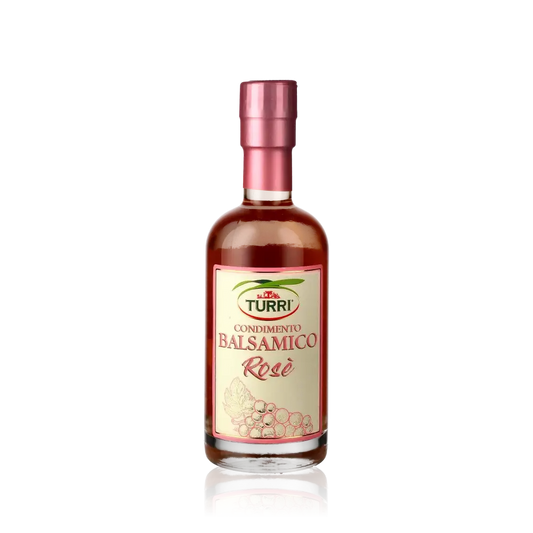 Turri Condimento Balsamico Rosé Flasche vor schwarzem Hintergrund.