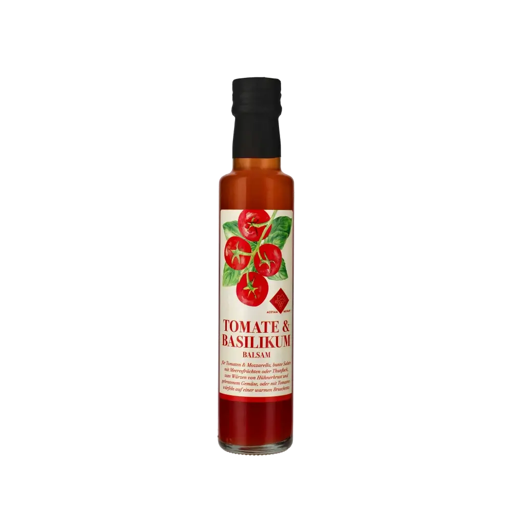 Murani Tomate Basilikum Balsamessig Flasche vor schwarzem Hintergrund.