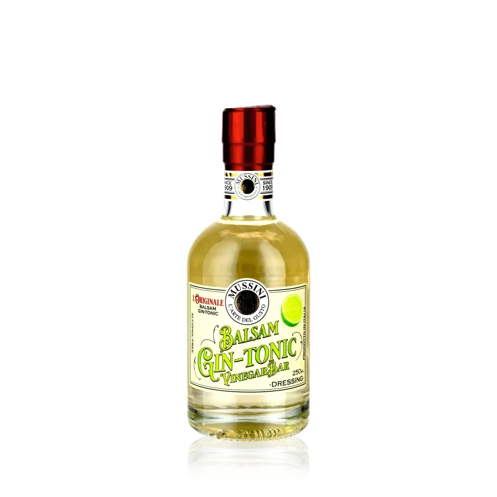 Mussini Balsam Gin Tonic Vinegar Flasche auf schwarzem Hintergrund.