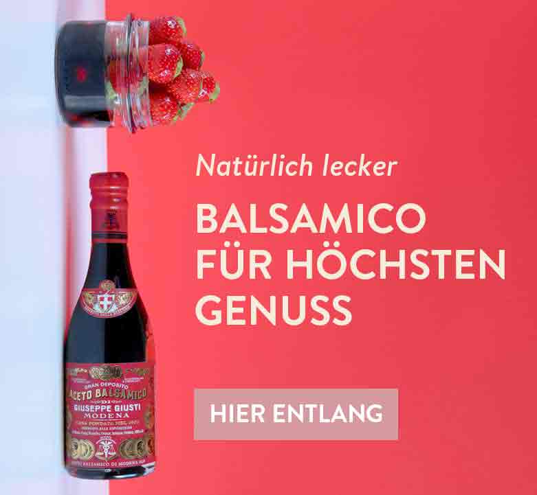 Balsamico-Essig Giuseppe Giusti, Erdbeeren, roter Hintergrund, Text.